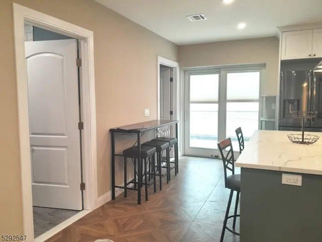 a very nice looking dining room with a large window