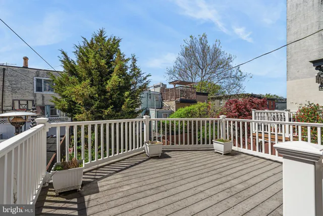 a view of a wooden roof deck