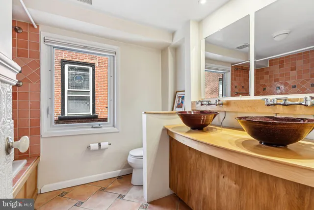 a bathroom with a tub and shower