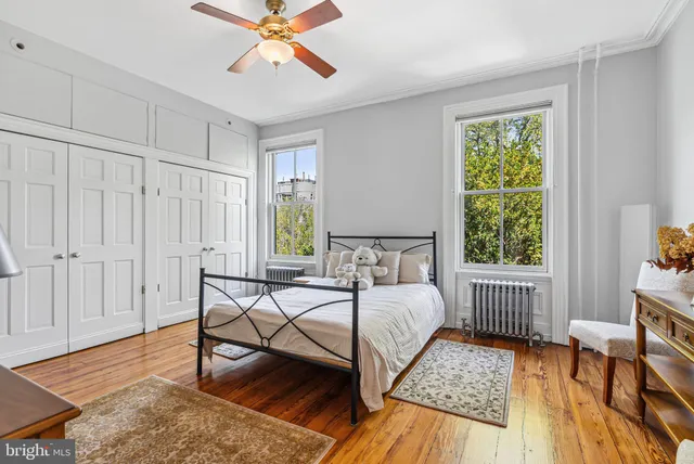 a bedroom with bed and a window