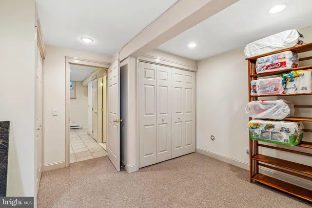 an empty room with closet and racks
