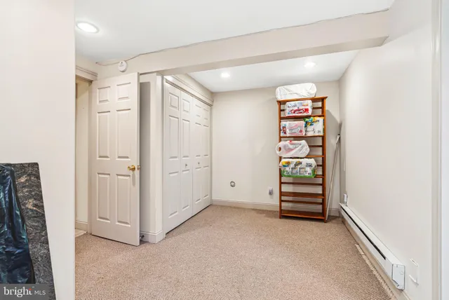 a bathroom with a sink mirror vanity and toilet