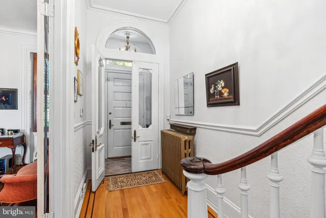 a view of an entryway with wooden floor