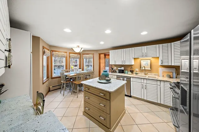 a kitchen with sink cabinets and stove