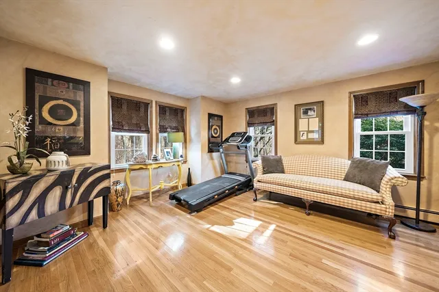 a living room with furniture and a floor to ceiling window