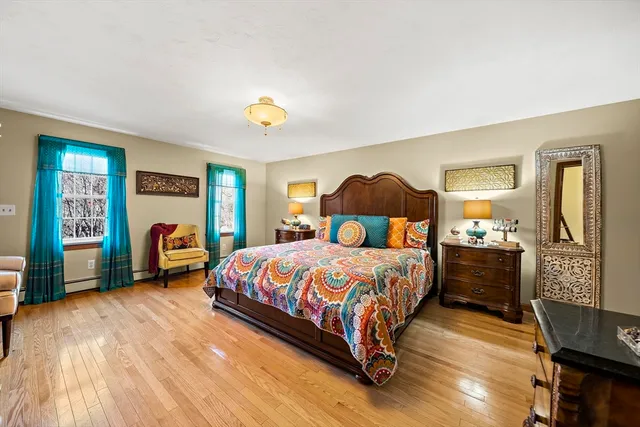 a bedroom with a bed and a view of en suite bathroom