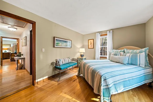 a bedroom with bed and window