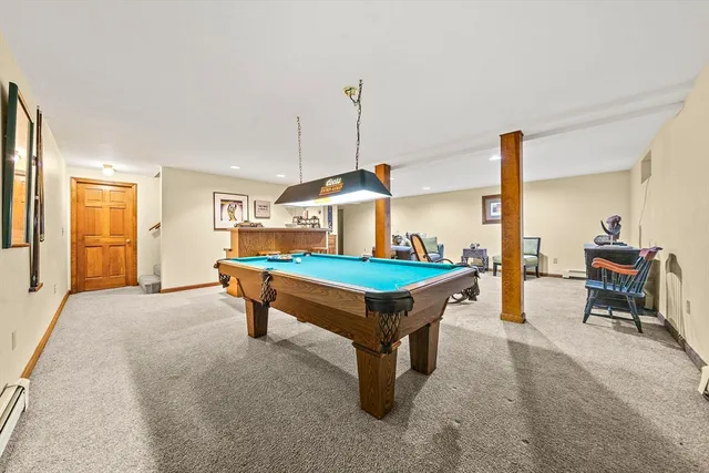 a living room with furniture a table and chairs