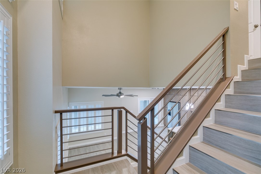 540 Sutters Mill Road Henderson, NV 89014 - Photo 9 of 46 This interior showcases a striking staircase with contemporary railing.