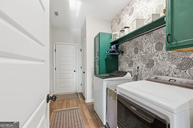 a utility room with dryer and washer