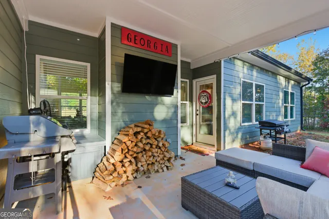 a living room with furniture fireplace and flat screen tv