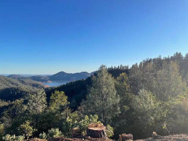 a view of an ocean beach and mountain