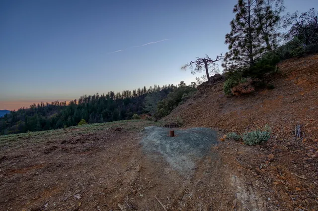 a view of a field with an ocean view