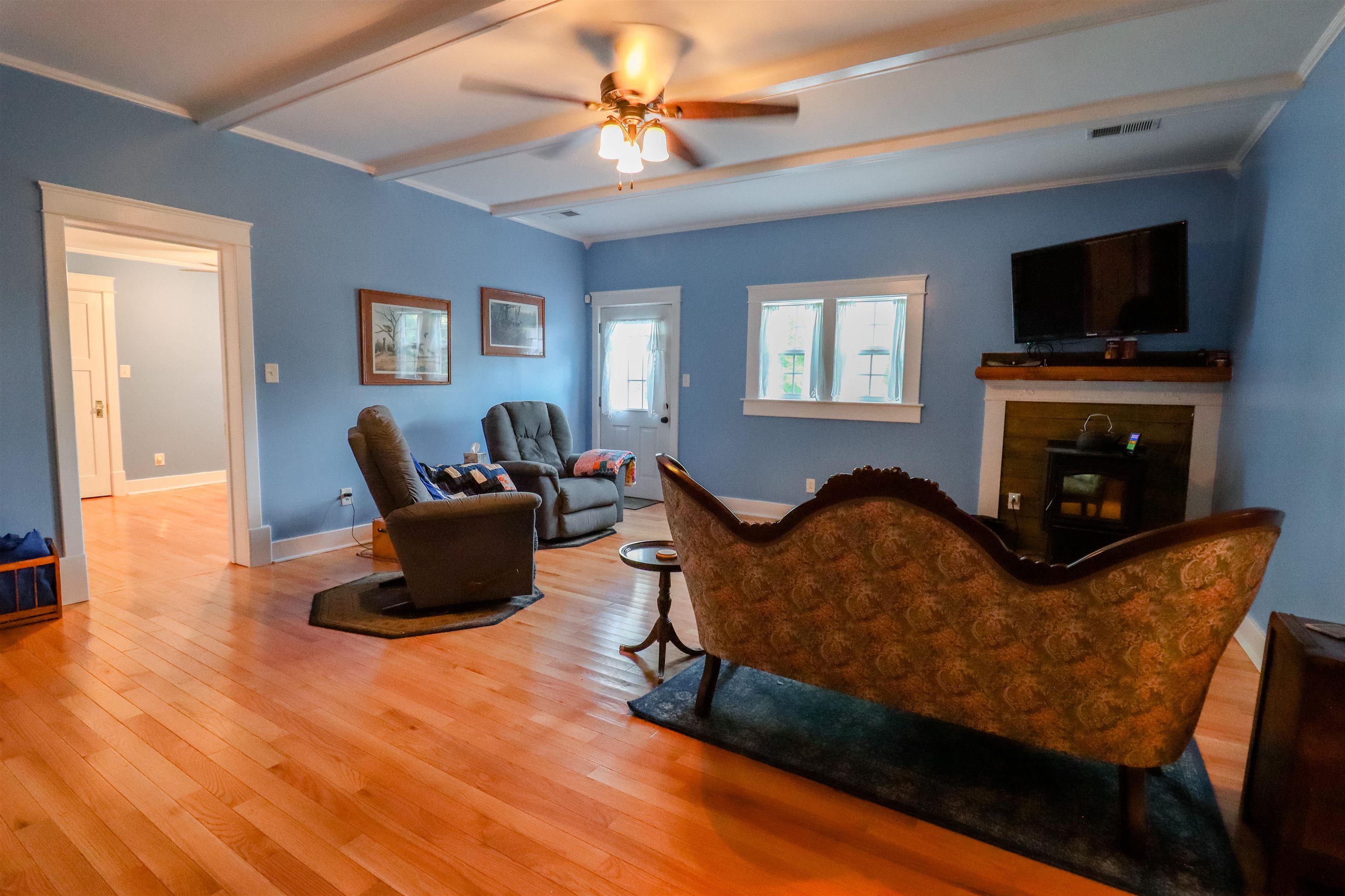 2156 Wadsworth Road Ripley, TN 38063 - Photo 10 of 25 a living room with furniture fireplace and a flat screen tv