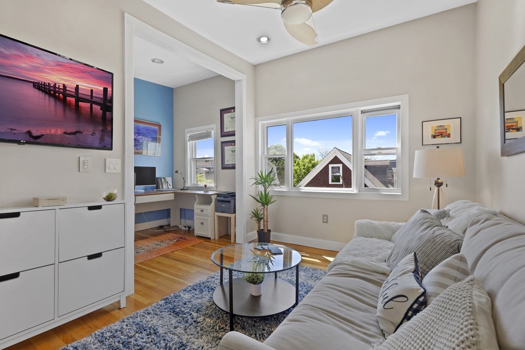 522 East 8th Street, Unit 3 Boston, MA 02127 - Photo 1 of 16 a living room with furniture and wooden floor