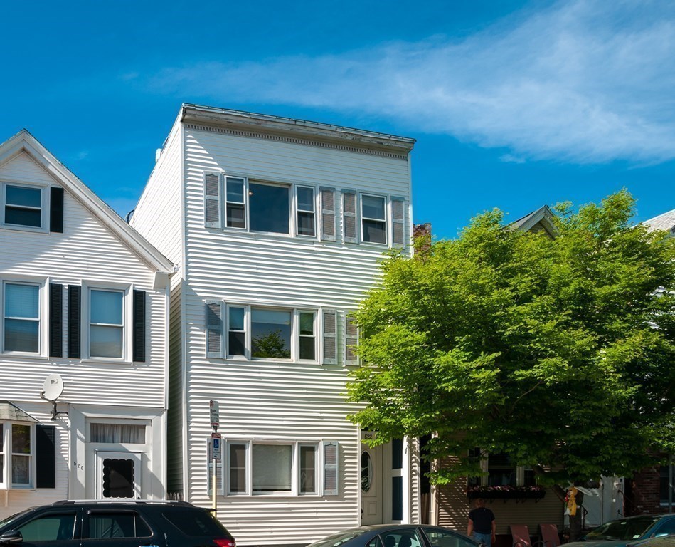 522 East 8th Street, Unit 3 Boston, MA 02127 - Photo 16 of 16 a front view of a house with a yard