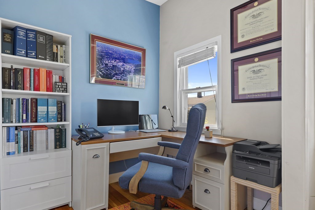 522 East 8th Street, Unit 3 Boston, MA 02127 - Photo 5 of 16 a workspace with furniture and bookshelf