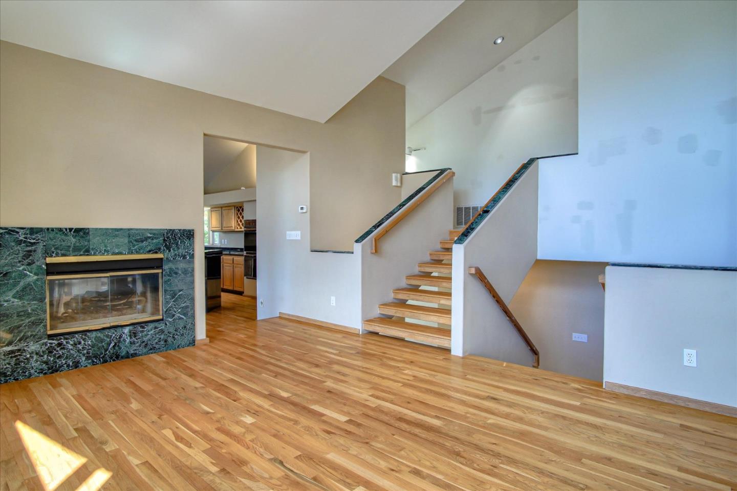 3435 Rio Road Carmel, CA 93923 - Photo 30 of 69 a view of a livingroom with wooden floor and a fireplace