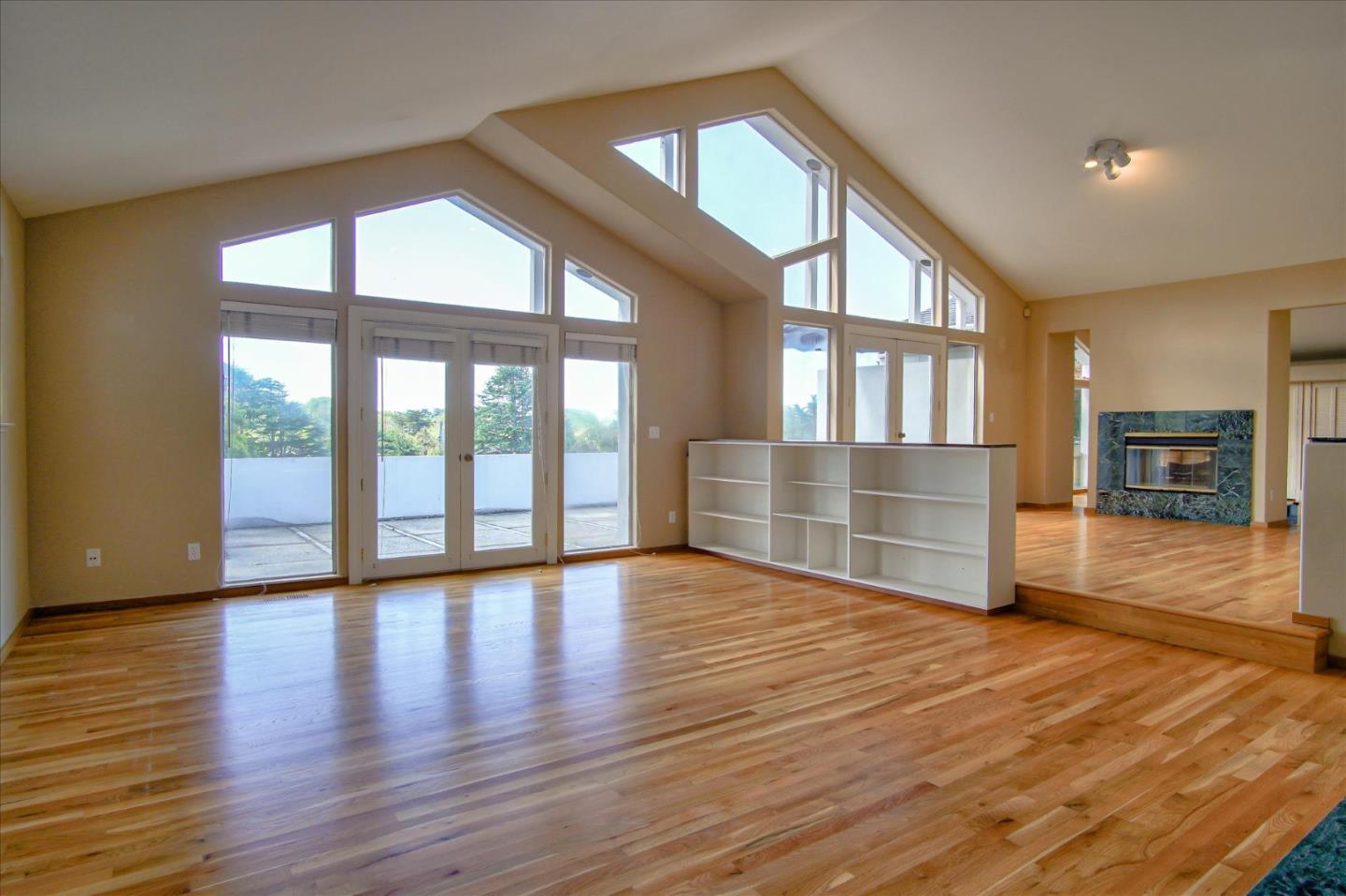 3435 Rio Road Carmel, CA 93923 - Photo 4 of 69 a view of an empty room with wooden floor and a window