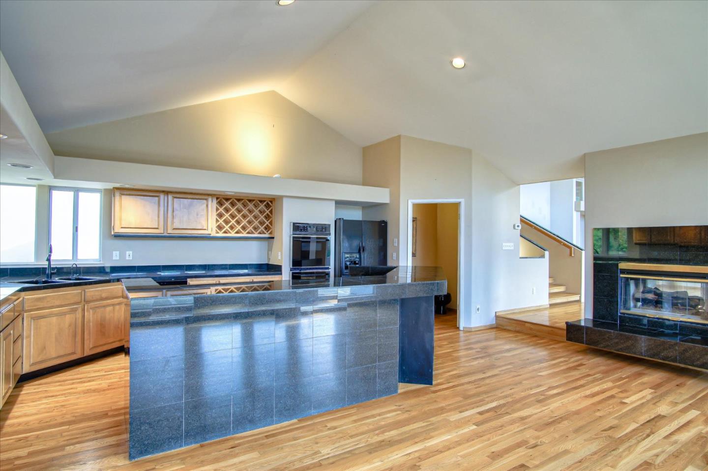3435 Rio Road Carmel, CA 93923 - Photo 36 of 69 a kitchen with stainless steel appliances granite countertop a stove a sink and a refrigerator