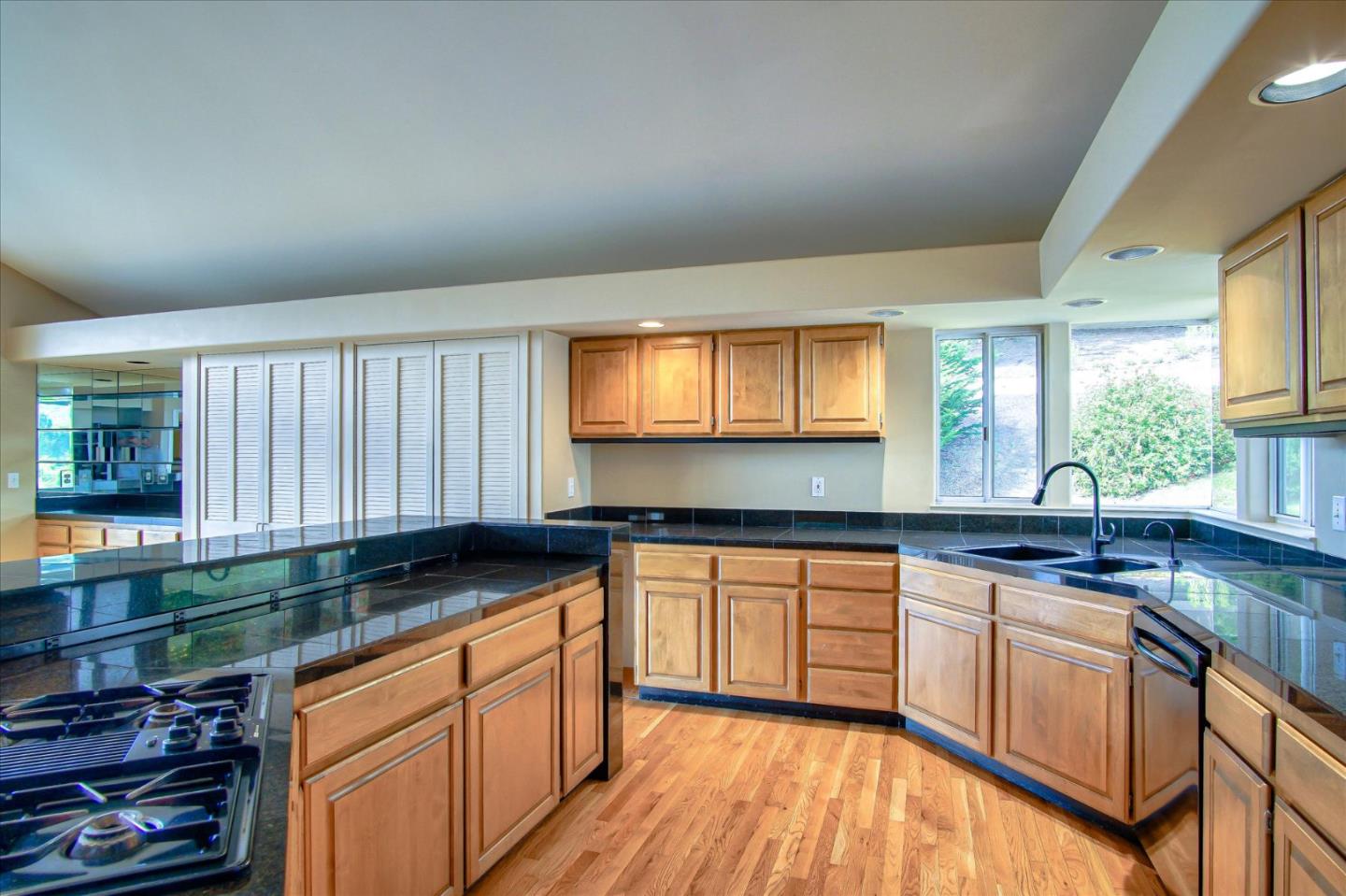 3435 Rio Road Carmel, CA 93923 - Photo 38 of 69 a kitchen with stainless steel appliances granite countertop a sink stove and cabinets