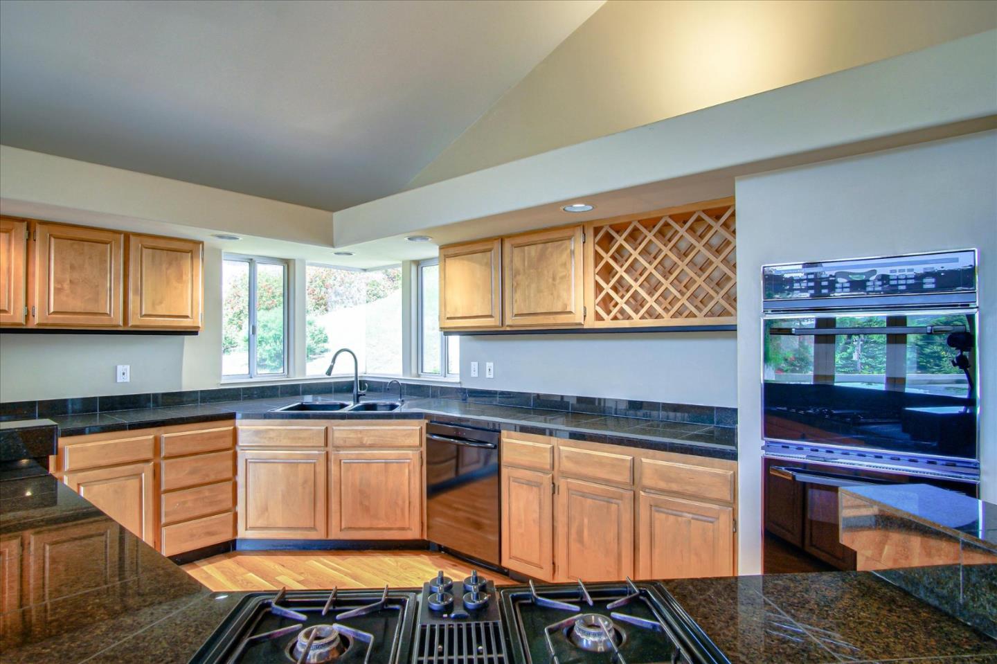 3435 Rio Road Carmel, CA 93923 - Photo 40 of 69 a kitchen that has a sink and a stove in it