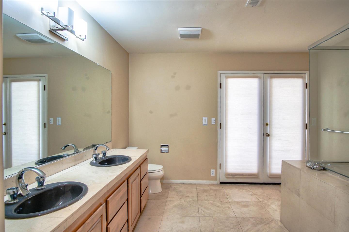 3435 Rio Road Carmel, CA 93923 - Photo 56 of 69 a bathroom with a sink and a mirror