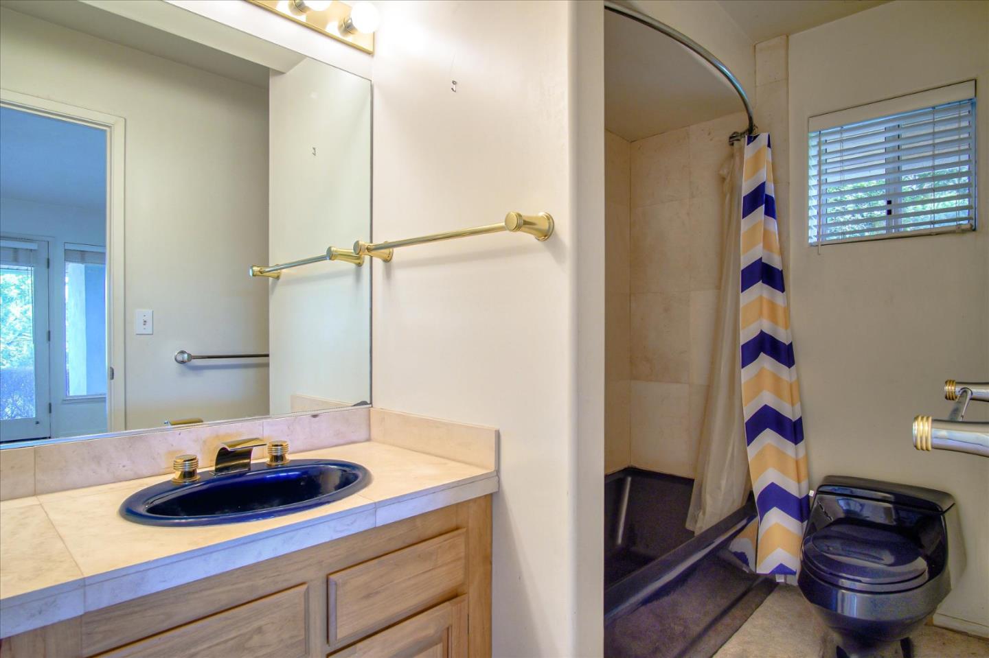 3435 Rio Road Carmel, CA 93923 - Photo 58 of 69 a bathroom with a sink and a mirror