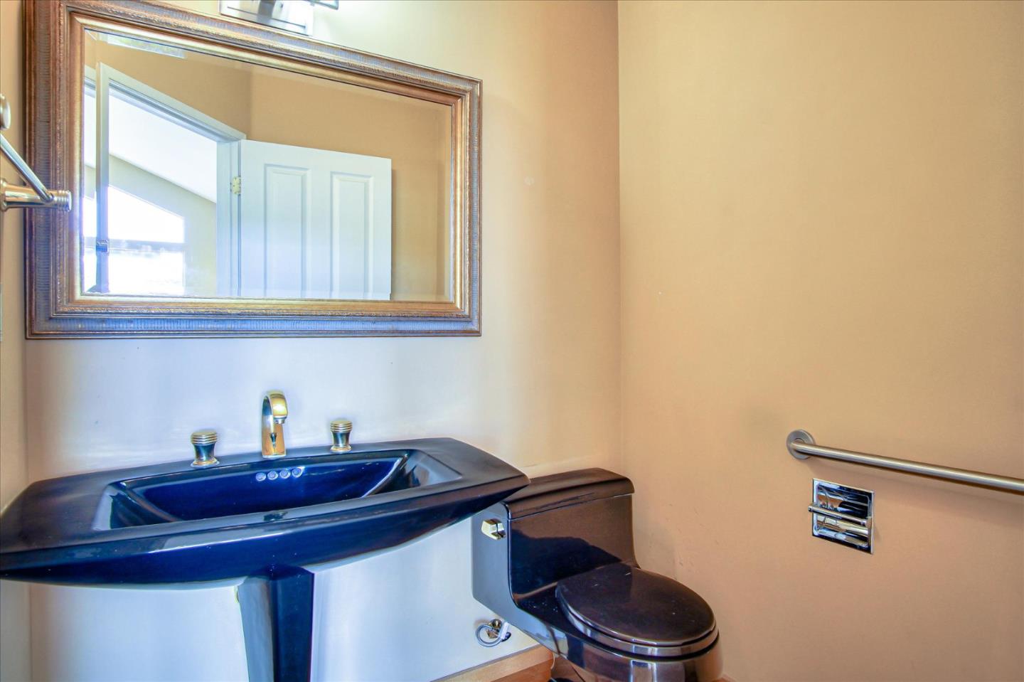 3435 Rio Road Carmel, CA 93923 - Photo 59 of 69 a bathroom with a sink a toilet and a mirror