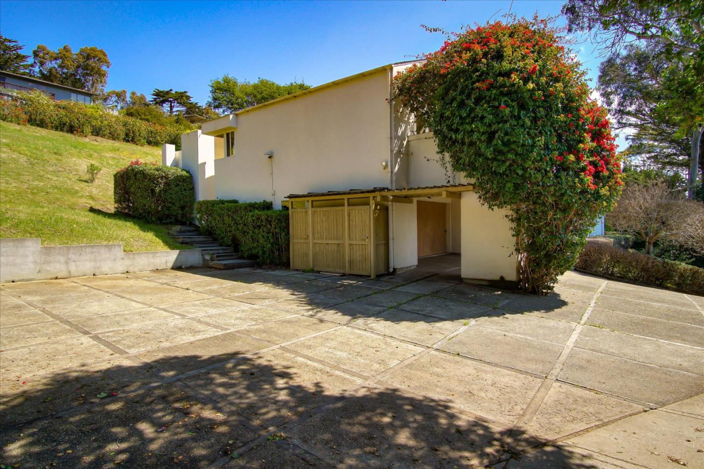 3435 Rio Road Carmel, CA 93923 - Photo 62 of 69 a view of backyard of house and car parked on road