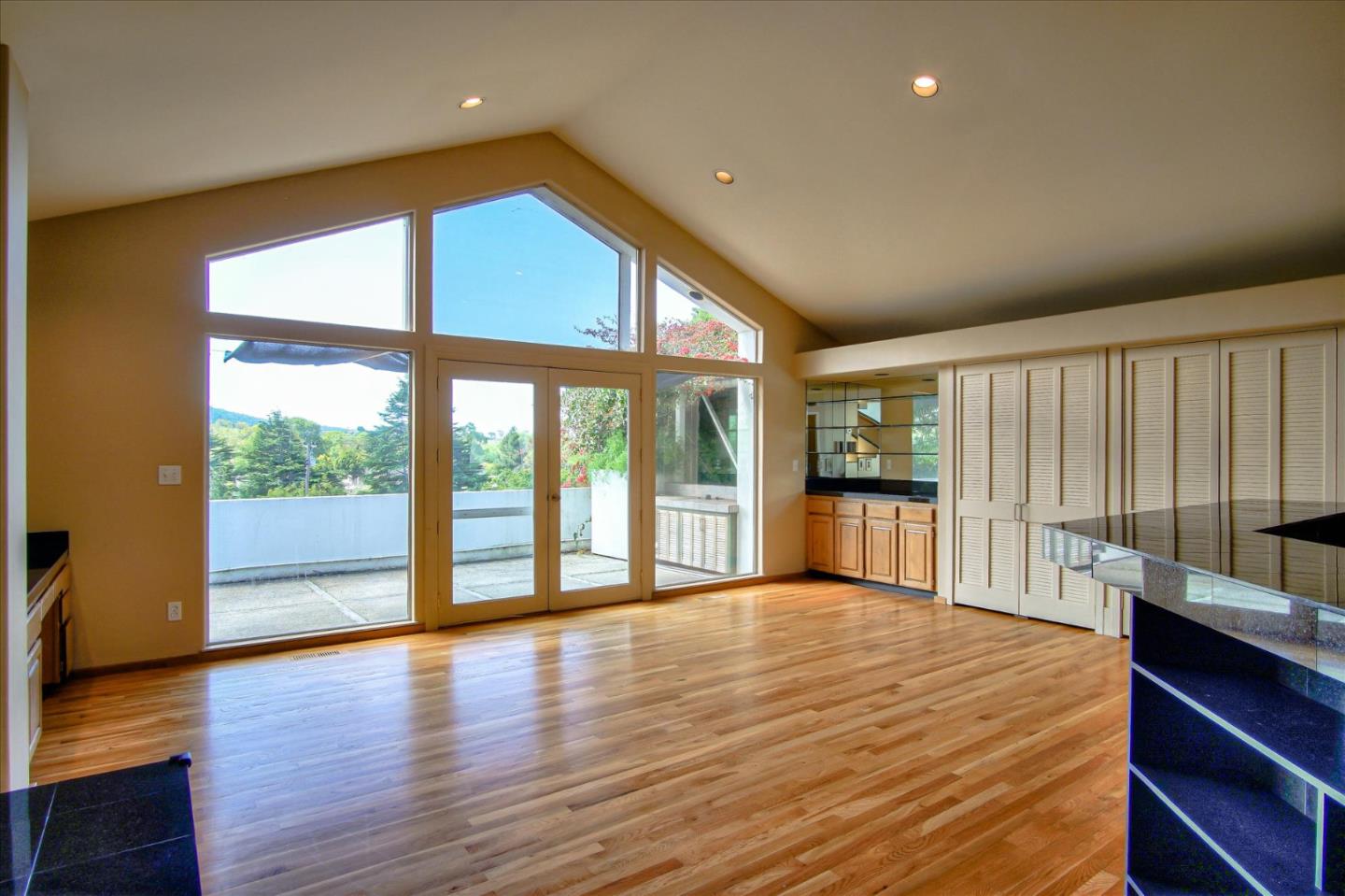 3435 Rio Road Carmel, CA 93923 - Photo 8 of 69 a view of an empty room with wooden floor and a window