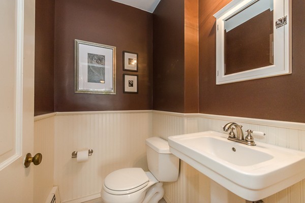 18 Woodside Road Topsfield, MA 01983 - Photo 16 of 30 a bathroom with a sink mirror and toilet