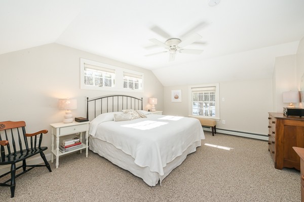 18 Woodside Road Topsfield, MA 01983 - Photo 18 of 30 a bedroom with a bed and a window