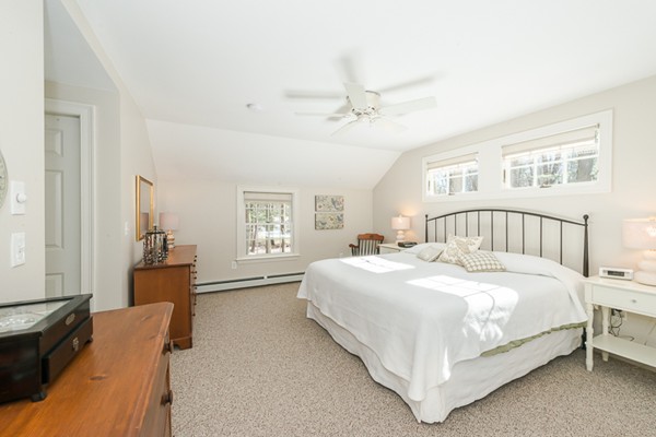 18 Woodside Road Topsfield, MA 01983 - Photo 19 of 30 a bedroom with a bed and wooden floor