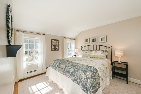 18 Woodside Road Topsfield, MA 01983 - Photo 21 of 30 a bedroom with a large bed and a window