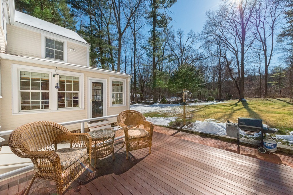 18 Woodside Road Topsfield, MA 01983 - Photo 27 of 30 a view of swimming pool with seating area and trees in the background
