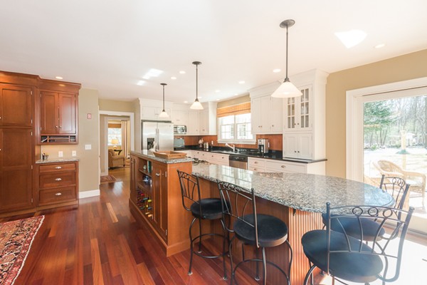 18 Woodside Road Topsfield, MA 01983 - Photo 4 of 30 a kitchen with stainless steel appliances granite countertop a kitchen island hardwood floor sink stove dining table and chairs