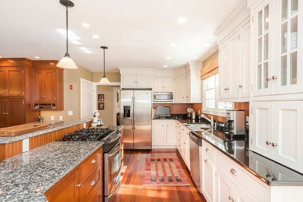 18 Woodside Road Topsfield, MA 01983 - Photo 5 of 30 a kitchen with stainless steel appliances granite countertop a stove a sink and a refrigerator