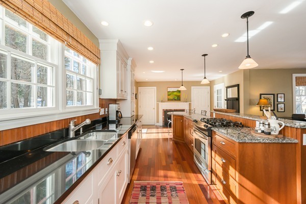 18 Woodside Road Topsfield, MA 01983 - Photo 7 of 30 a large kitchen with granite countertop a large counter top appliances and a view of living room