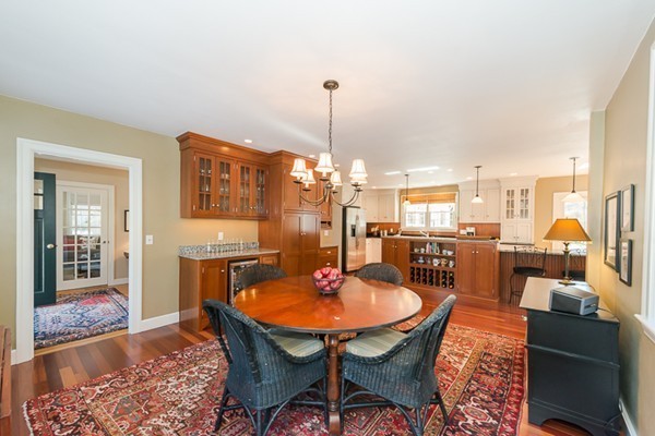 18 Woodside Road Topsfield, MA 01983 - Photo 8 of 30 a dining room with furniture a chandelier and wooden floor
