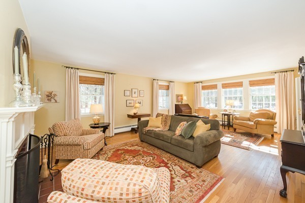 18 Woodside Road Topsfield, MA 01983 - Photo 10 of 30 a living room with furniture wooden floor and a large window