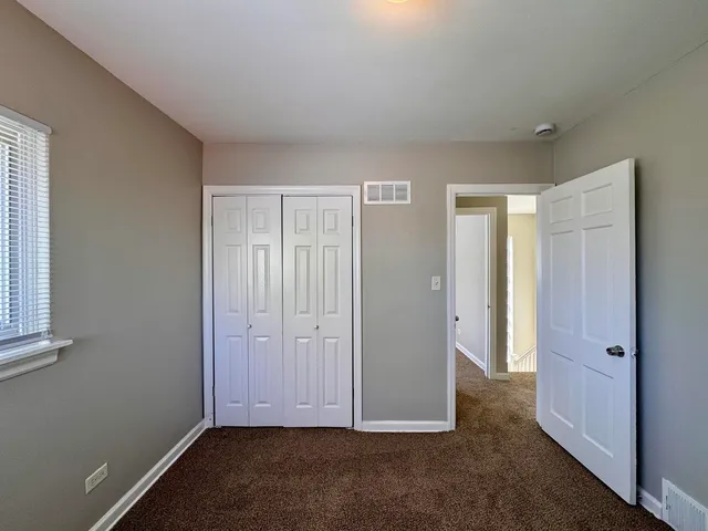 an empty room with closet
