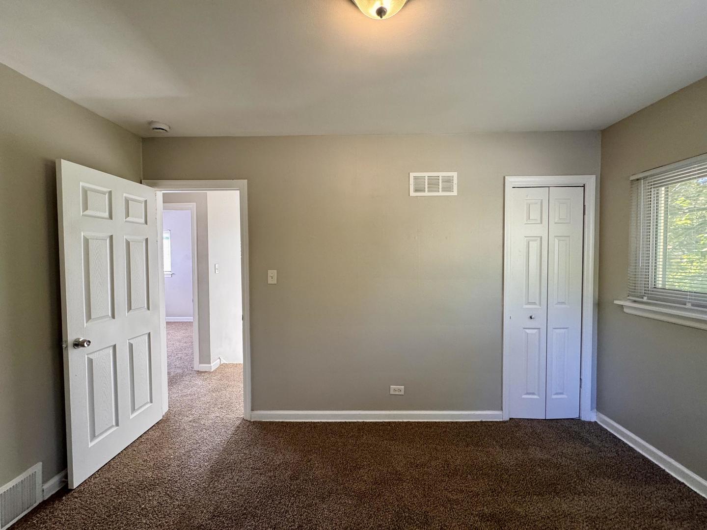 16727 Head Avenue Hazel Crest, IL 60429 - Photo 10 of 22 an empty room with windows