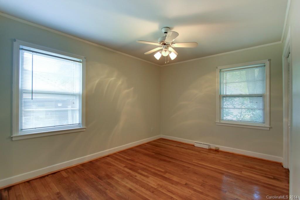 538 Scaleybark Road Charlotte, NC 28209 - Photo 11 of 20 a view of empty room with wooden floor and fan