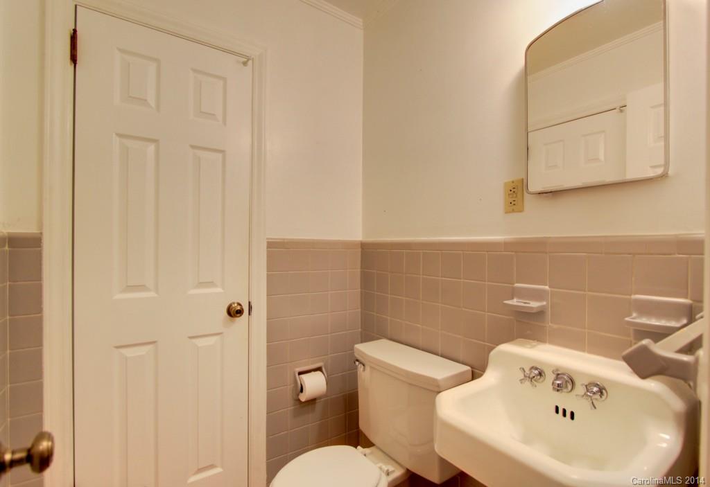 538 Scaleybark Road Charlotte, NC 28209 - Photo 15 of 20 a white toilet sitting next to a bathroom sink