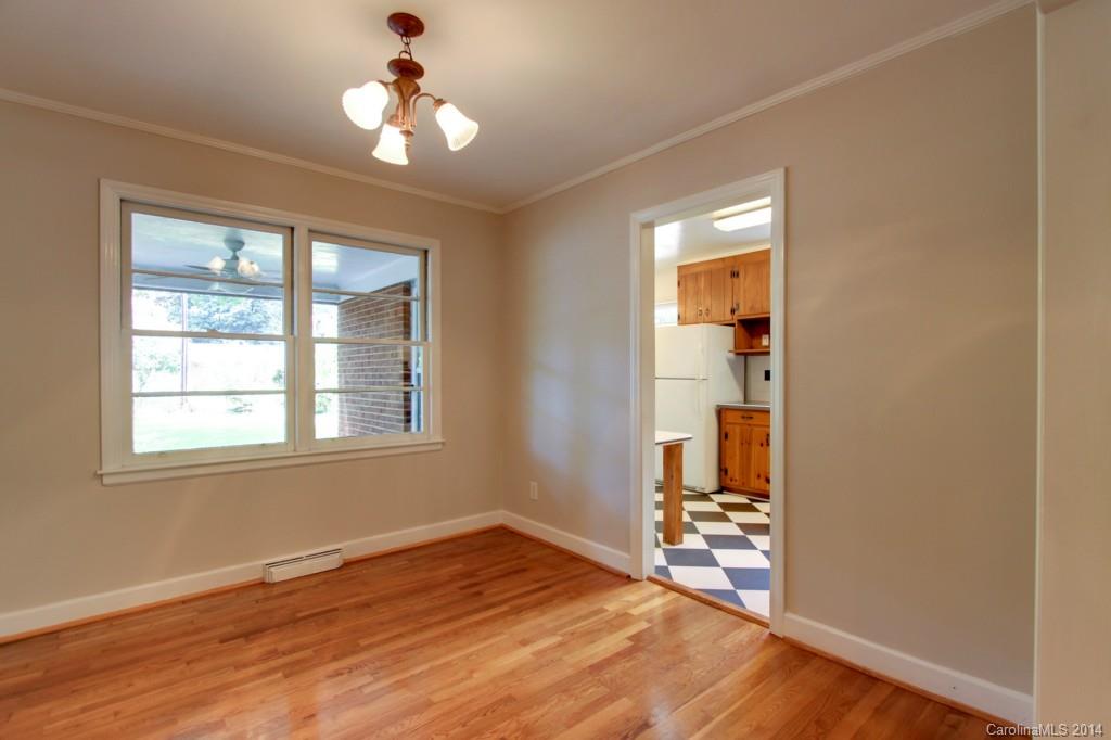 538 Scaleybark Road Charlotte, NC 28209 - Photo 5 of 20 wooden floor in an empty room with a window