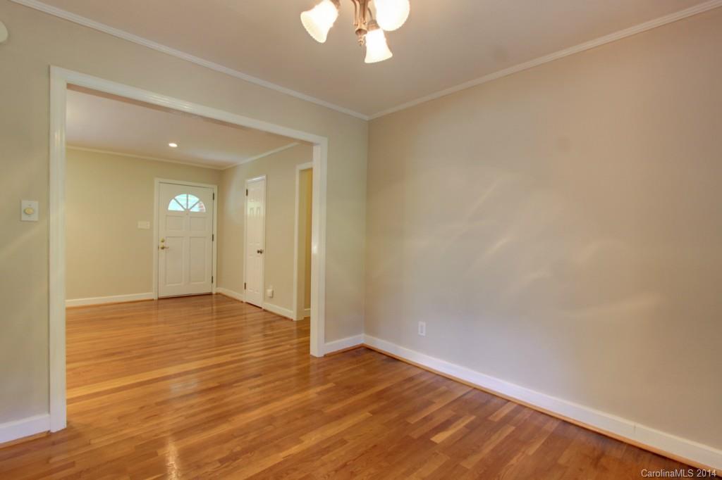 538 Scaleybark Road Charlotte, NC 28209 - Photo 6 of 20 wooden floor in an empty room with a window