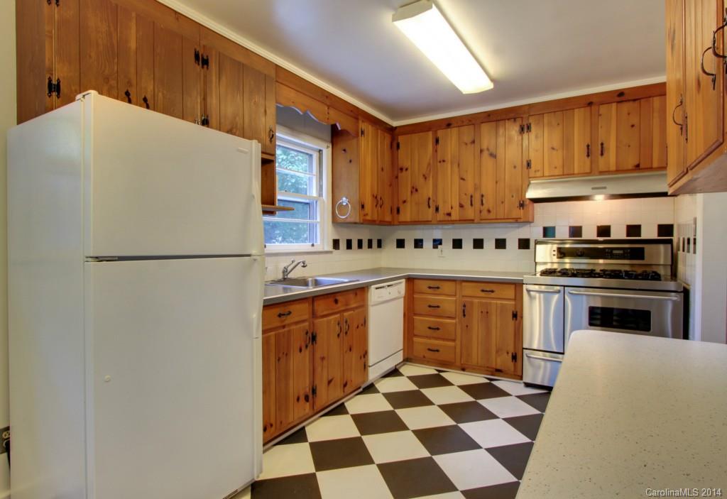538 Scaleybark Road Charlotte, NC 28209 - Photo 8 of 20 a kitchen with stainless steel appliances a refrigerator sink and cabinets