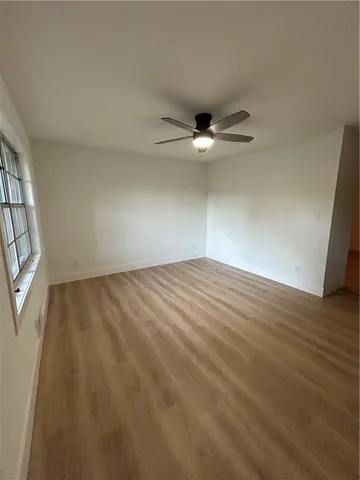 a view of an empty room with a window