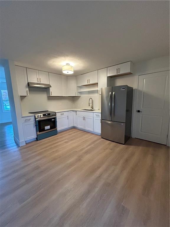 1270 Morrow Road Morrow, GA 30260 - Photo 2 of 12 a kitchen with stainless steel appliances a refrigerator and a stove